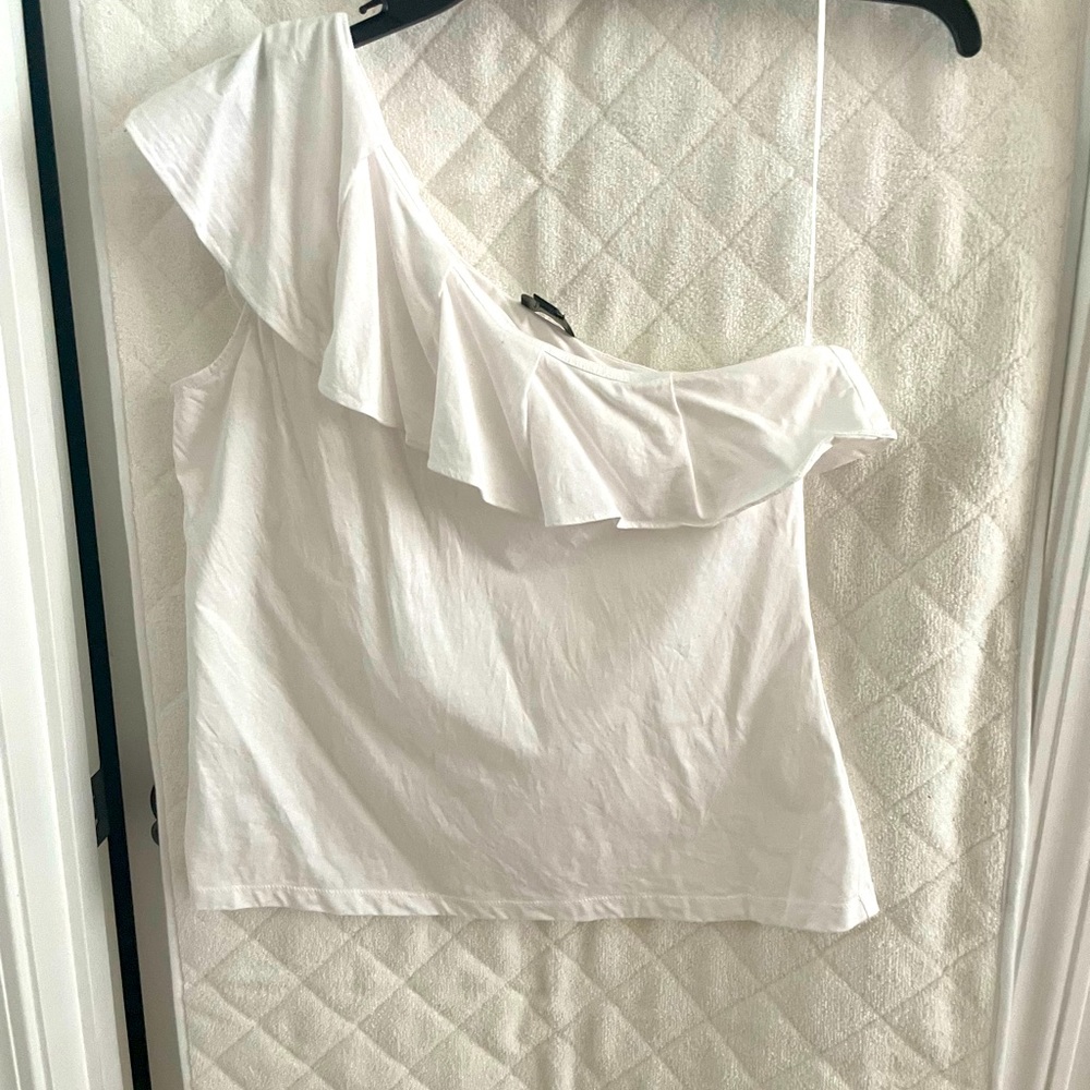 One shoulder ruffle white top.